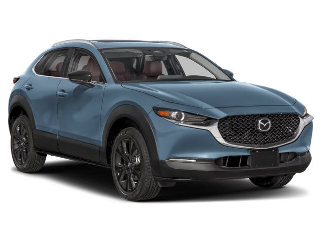 A blue 2026 Mazda CX-30 crossover SUV parked at an angle, with black alloy wheels and red interior.